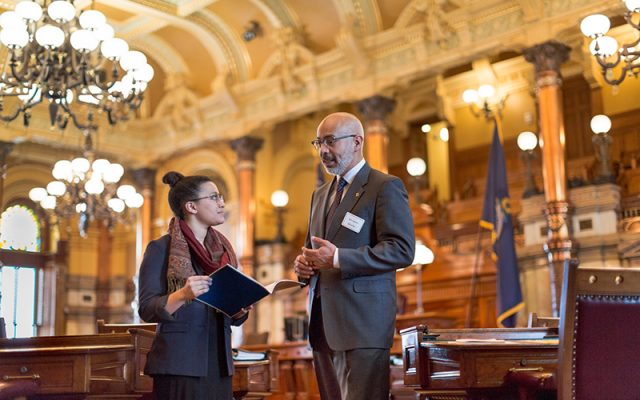 Undergraduate and mentor in the Senate Chambers at the Kansas State Capitol.